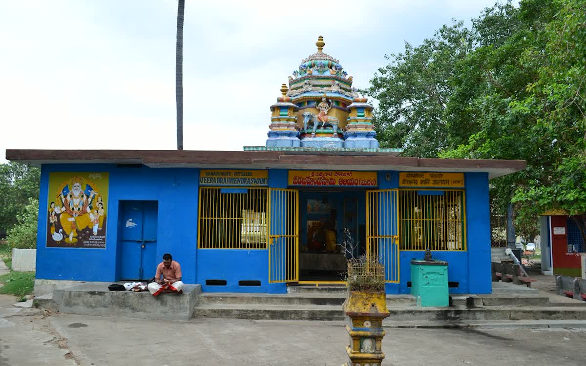 A small blue temple to the Swamy with a painted tower